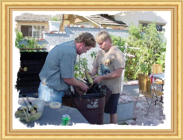 Eddie and Mich shucking corn