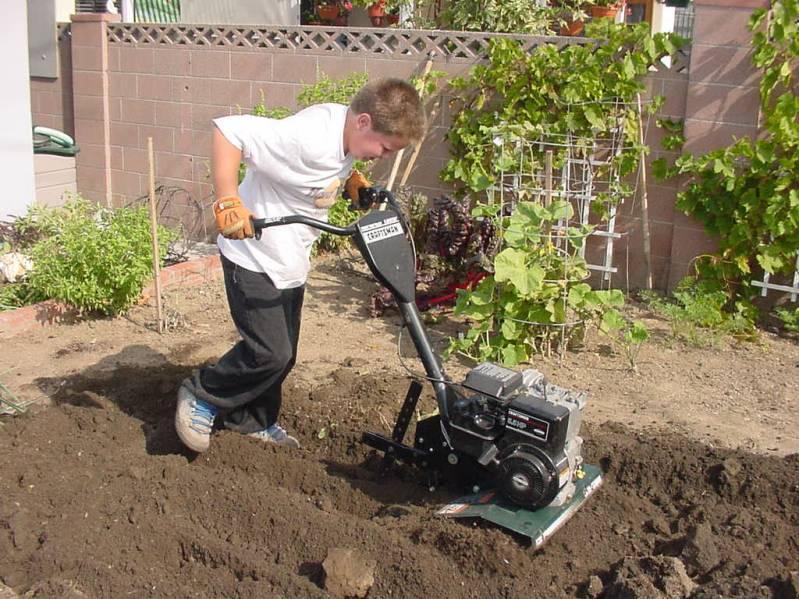 Zachary at 12 running the machinery that keeps the garden going!