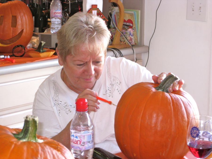 Carving the pumpkins with family at the Liles home