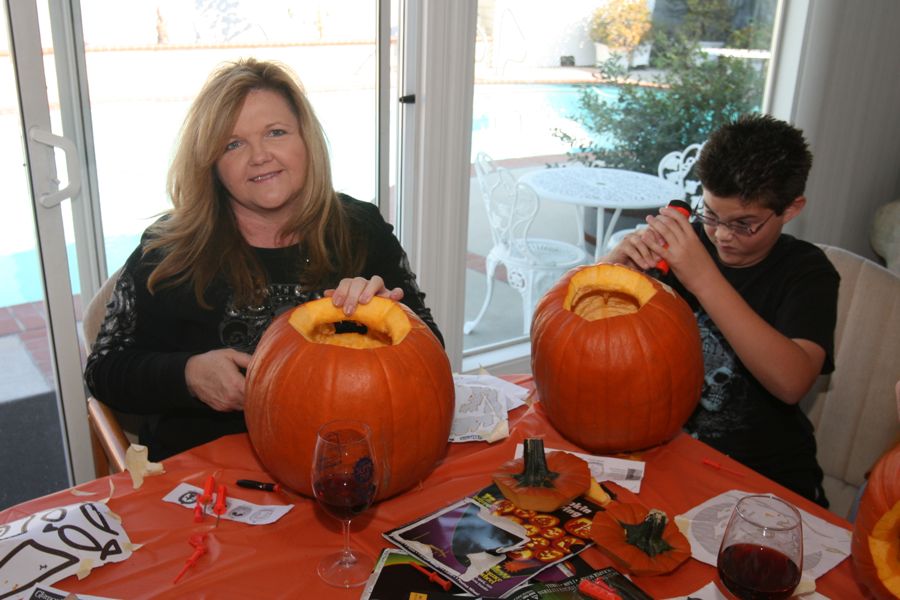 Carving the pumpkins with family at the Liles home