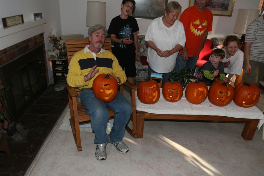 Carving the pumpkins with family at the Liles home