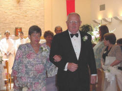 Paul and Sue walk the aisle at Robin's wedding