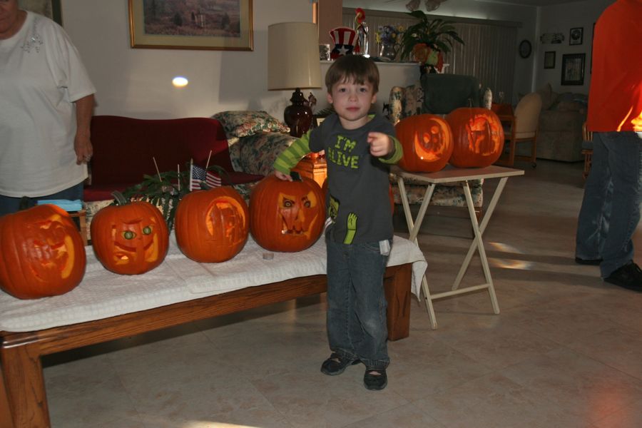 Carving the pumpkins with family at the Liles home